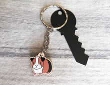 Load image into Gallery viewer, Mini guinea pig keyring, small cavy wooden key fob, ethically sourced wood, tri colour guinea pig key chain, bag charm