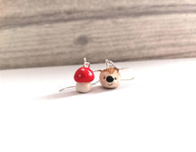 Load image into Gallery viewer, Hedgehog and toadstool earrings, ceramic, miniature hedgehogs, mini hogs, tiny mushroom, mis matched autumn sterling silver earrings.
