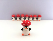 Load image into Gallery viewer, Toadstool penguin. Little penguin in a box, autumn miniature pottery penguin in a red and white mushroom, ceramic quirky Halloween gift