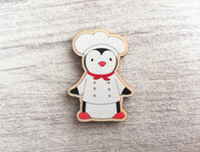 Load image into Gallery viewer, Kitchen penguin magnet set, little chef, baking, cooking, aprons, cake, wooden fridge magnet. Eco friendly responsibly sourced wood