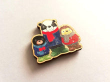 Load image into Gallery viewer, Small fridge magnet, badger, mole and hedgehog wearing coats, scarves and wellies. Woodland animals. Made from responsibly sourced, eco friendly wood