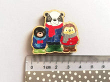Load image into Gallery viewer, Small fridge magnet, badger, mole and hedgehog wearing coats, scarves and wellies. Woodland animals. Made from responsibly sourced, eco friendly wood