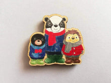 Load image into Gallery viewer, Small fridge magnet, badger, mole and hedgehog wearing coats, scarves and wellies. Woodland animals. Made from responsibly sourced, eco friendly wood
