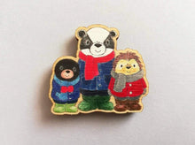 Load image into Gallery viewer, Small fridge magnet, badger, mole and hedgehog wearing coats, scarves and wellies. Woodland animals. Made from responsibly sourced, eco friendly wood