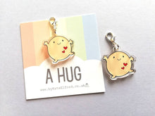 Load image into Gallery viewer, A hug stitch marker, cute positive charm, friendship, postable hug, supportive, recycled acrylic