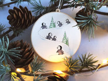 Load image into Gallery viewer, Little wooden penguin decoration. Playing in the snow Christmas ornament, eco friendly wood. Penguin chicks
