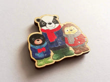 Load image into Gallery viewer, Small fridge magnet, badger, mole and hedgehog wearing coats, scarves and wellies. Woodland animals. Made from responsibly sourced, eco friendly wood