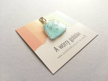 Load image into Gallery viewer, A worry gobbler stitch marker, cute positive charm, friendship, postable hug, supportive, anti anxiety recycled acrylic