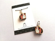 Load image into Gallery viewer, Guinea pig stitch marker, mini wooden cavy, ethically sourced wood, tri colour guinea pig charm