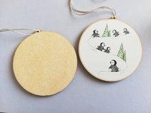 Load image into Gallery viewer, Little wooden penguin decoration. Playing in the snow Christmas ornament, eco friendly wood. Penguin chicks