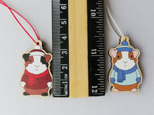Load image into Gallery viewer, Guinea pig Christmas little decorations. Ethically sourced eco friendly. Choice of blue or red. Cute Christmas tree ornaments.