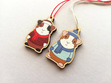 Load image into Gallery viewer, Guinea pig Christmas little decorations. Ethically sourced eco friendly. Choice of blue or red. Cute Christmas tree ornaments.