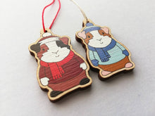 Load image into Gallery viewer, Guinea pig Christmas little decorations. Ethically sourced eco friendly. Choice of blue or red. Cute Christmas tree ornaments.