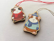 Load image into Gallery viewer, Guinea pig Christmas little decorations. Ethically sourced eco friendly. Choice of blue or red. Cute Christmas tree ornaments.