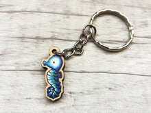 Load image into Gallery viewer, Tiny seahorse keyring, mini seahorse wooden key fob, ethically sourced wood, seaside key chain, coastal bag charm