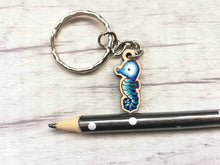 Load image into Gallery viewer, Tiny seahorse keyring, mini seahorse wooden key fob, ethically sourced wood, seaside key chain, coastal bag charm