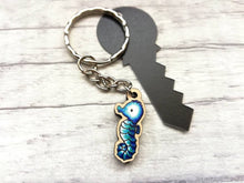 Load image into Gallery viewer, Tiny seahorse keyring, mini seahorse wooden key fob, ethically sourced wood, seaside key chain, coastal bag charm