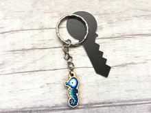 Load image into Gallery viewer, Tiny seahorse keyring, mini seahorse wooden key fob, ethically sourced wood, seaside key chain, coastal bag charm