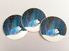 Load image into Gallery viewer, Penguin asleep under the stars sticker, Northern lights, aurora reading, book sticker