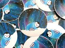 Load image into Gallery viewer, Penguin asleep under the stars sticker, Northern lights, aurora reading, book sticker