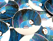 Load image into Gallery viewer, Penguin asleep under the stars sticker, Northern lights, aurora reading, book sticker