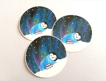 Load image into Gallery viewer, Penguin asleep under the stars sticker, Northern lights, aurora reading, book sticker