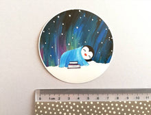 Load image into Gallery viewer, Penguin asleep under the stars sticker, Northern lights, aurora reading, book sticker