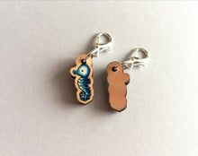 Load image into Gallery viewer, Seahorse stitch marker, mini blue seahorse wooden charm, ethically sourced wood, little crochet stitch marker