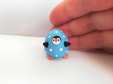 Load image into Gallery viewer, Penguin egg. Little penguin in a polka dot egg, black and white miniature pottery penguin in a blue egg, ceramic penguin gift
