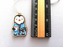 Load image into Gallery viewer, Penguin dressing gown Christmas decoration, eco friendly, ethically sourced wood, cute little tag, waiting for Santa