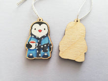 Load image into Gallery viewer, Penguin dressing gown Christmas decoration, eco friendly, ethically sourced wood, cute little tag, waiting for Santa