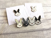 Load image into Gallery viewer, Rabbit enamel pins. Enamel badge. Enamel bunny brooch with pink heart shaped nose. Black, white, grey and white, black and white rabbits