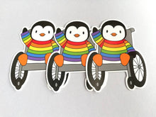 Load image into Gallery viewer, Penguin in a rainbow jumper, wheelchair vinyl penguin sticker