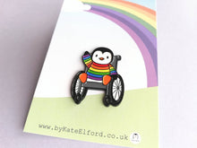 Load image into Gallery viewer, Penguin wearing a rainbow jumper, wheelchair enamel pin, penguin brooch