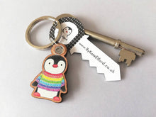 Load image into Gallery viewer, Rainbow penguin keyring, penguin rainbow jumper wooden key fob, ethically sourced wood, small penguin key chain, bag charm