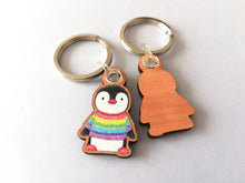 Load image into Gallery viewer, Rainbow penguin keyring, penguin rainbow jumper wooden key fob, ethically sourced wood, small penguin key chain, bag charm