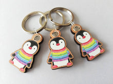 Load image into Gallery viewer, Rainbow penguin keyring, penguin rainbow jumper wooden key fob, ethically sourced wood, small penguin key chain, bag charm