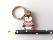 Load image into Gallery viewer, Rainbow penguin keyring, penguin rainbow jumper wooden key fob, ethically sourced wood, small penguin key chain, bag charm