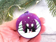 Load image into Gallery viewer, Penguin Christmas tree decoration. Frosted purple acrylic, penguins in the snow, tree Christmas ornament