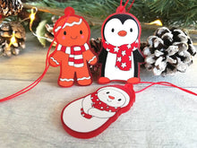 Load image into Gallery viewer, Penguin Christmas decorations. Set of three, frosted red acrylic penguin, snowman and gingerbread man. Cute Christmas tree ornaments.