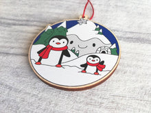 Load image into Gallery viewer, Penguin Christmas decoration. Snowy mountains small wooden ornament. Ethically sourced wood. Cute penguins Christmas tree ornaments.