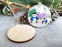 Load image into Gallery viewer, Penguin Christmas decoration. Snowy purple mountains small wooden ornament. Ethically sourced wood. Cute penguins Christmas tree ornaments.