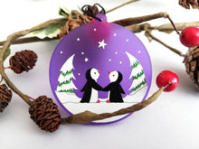 Load image into Gallery viewer, Penguin Christmas tree decoration. Frosted purple acrylic, penguins in the snow, tree Christmas ornament