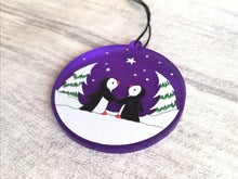 Load image into Gallery viewer, Penguin Christmas tree decoration. Frosted purple acrylic, penguins in the snow, tree Christmas ornament