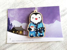 Load image into Gallery viewer, Penguin dressing gown Christmas decoration, eco friendly, ethically sourced wood, cute little tag, waiting for Santa