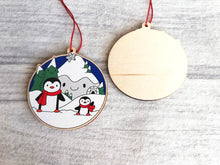 Load image into Gallery viewer, Penguin Christmas decoration. Snowy mountains small wooden ornament. Ethically sourced wood. Cute penguins Christmas tree ornaments.