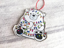 Load image into Gallery viewer, Polar bear Christmas tree decoration. Recycled acrylic Christmas ornament, polar bear tangled up in rainbow coloured fairy lights
