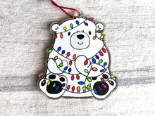 Load image into Gallery viewer, Polar bear Christmas tree decoration. Recycled acrylic Christmas ornament, polar bear tangled up in rainbow coloured fairy lights