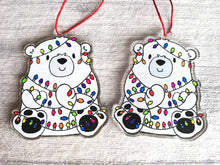 Load image into Gallery viewer, Polar bear Christmas tree decoration. Recycled acrylic Christmas ornament, polar bear tangled up in rainbow coloured fairy lights