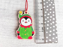 Load image into Gallery viewer, Penguin elf Christmas decoration. Small wooden elf penguin. Ethically sourced wood. Cute Christmas tree ornament